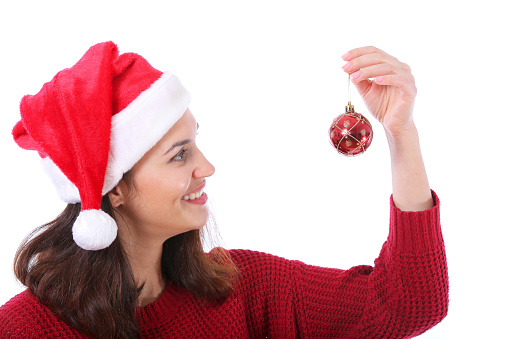 smiling young christmas woman holding christmas ball isolated on white background