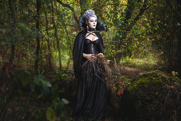 istock Scary girl witch in the forest. 613308682