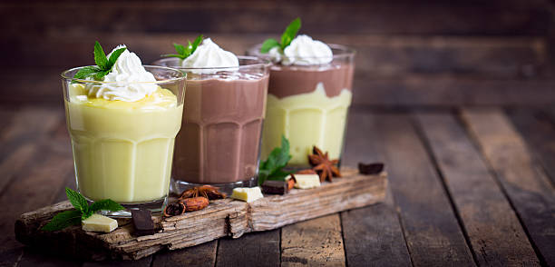 istock Chocolate and vanilla pudding with whipped cream 613310284