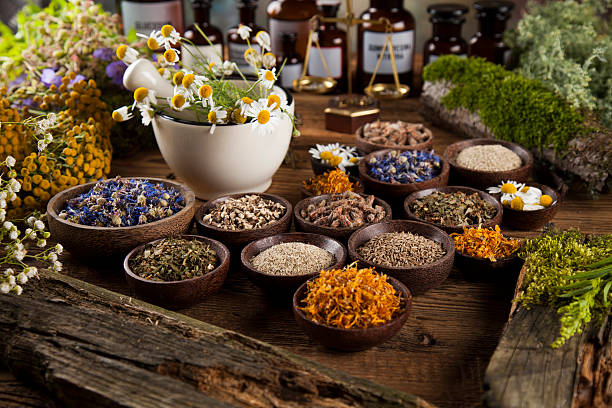 istock Natural medicine on wooden table background 613311314