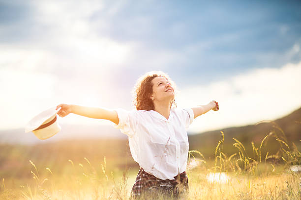 istock Girl enjoying nature on the field 613311882