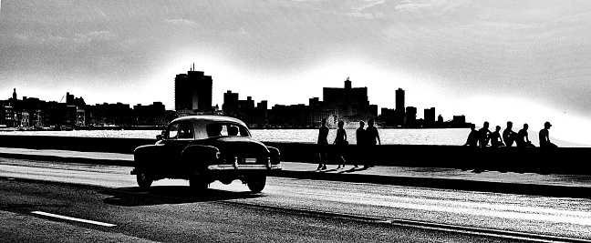 One of the Classic vintage American cars driving along the Malecon in Havana, Cuba.