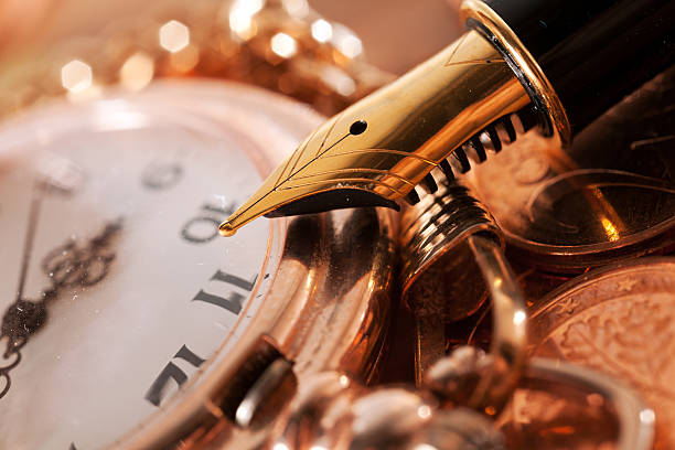istock Pen and pocket watch 613314554