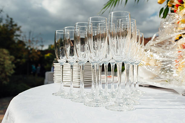 istock Wedding glasses filled with champagne at banquet 613314872