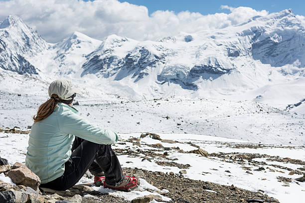 istock Young woman enjoying the mountain view. 613316998