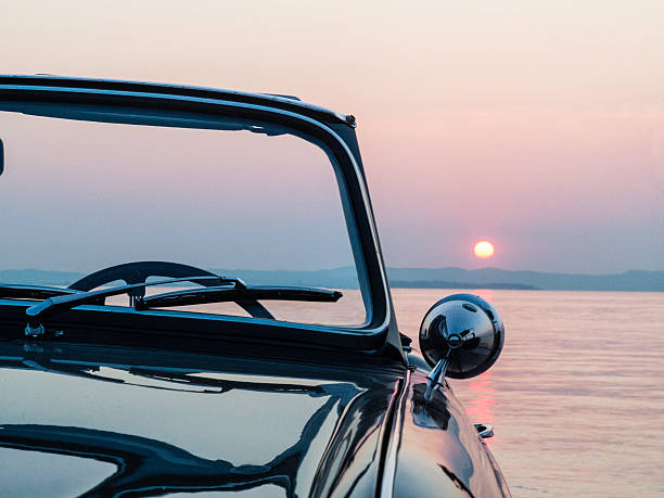 istock Sunset near the car 613318286