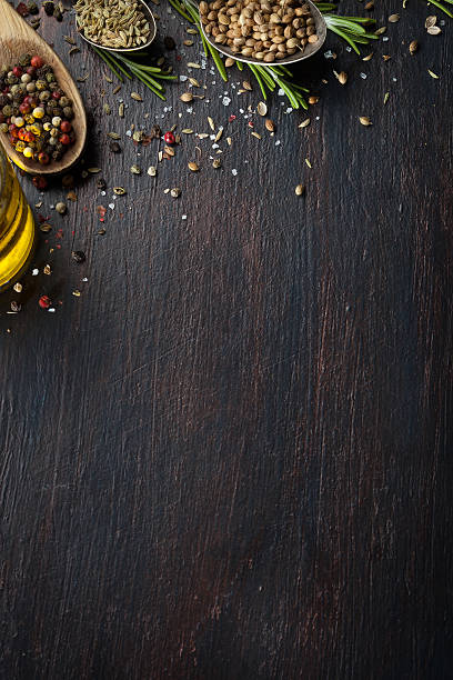 istock Various herbs and spices on dark wood table 613318662