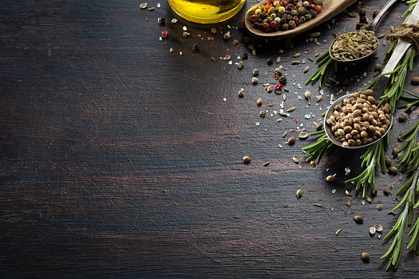istock Various herbs and spices on dark wood table 613319182