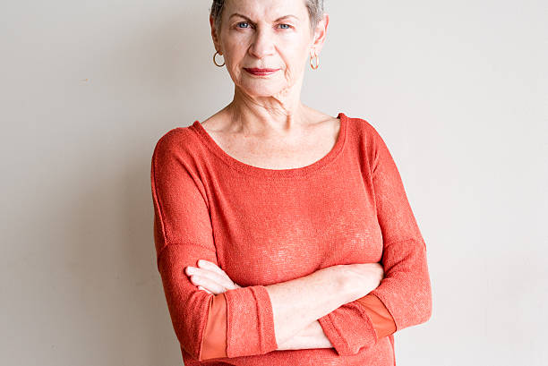 istock Older woman with arms crossed 613319870