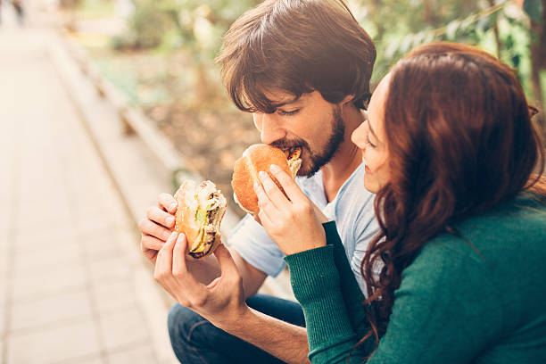 istock Woman feeding her boyfiend 613320146