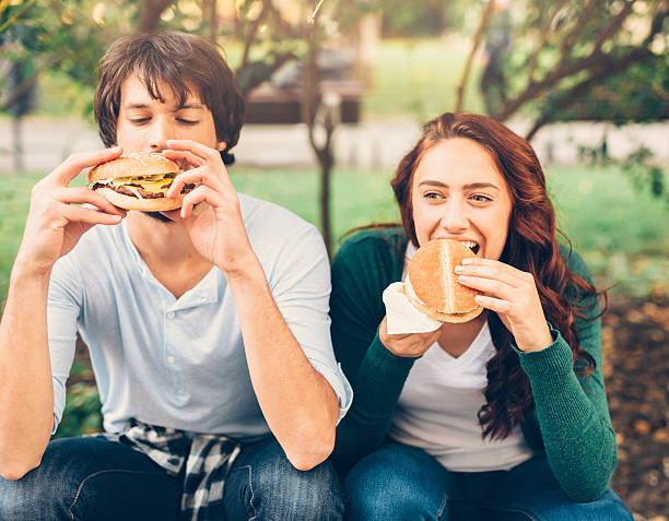istock Happy couple eating 613320192