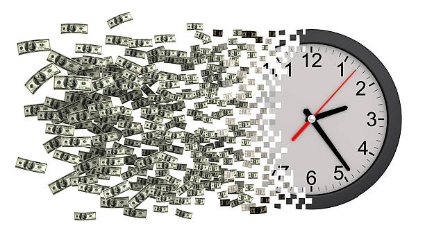 istock Time Is Money. Clock Falling Apart To Dollars 613320426