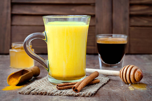 istock Turmeric golden milk latte with cinnamon sticks and honey 613321446