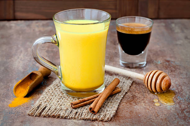 istock Turmeric golden milk latte with cinnamon sticks and honey 613321488