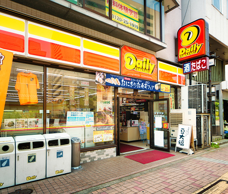 Nagano, Japan - May 20, 2016: Daily Yamazaki convenience store front in Nagano, Japan with garbage and recycling bins in front of it.