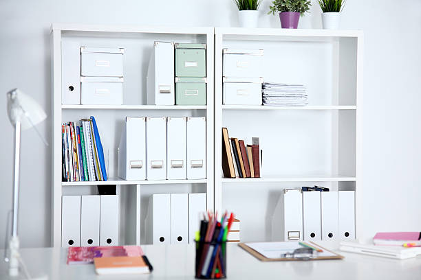 istock bookcase with folders in the office businessman 613323120