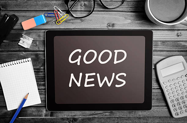 The words Good News on tablet stock photo