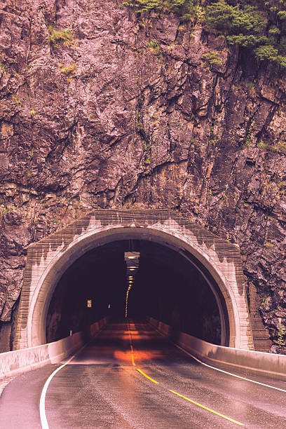 istock tunnel on the norwegian mountain road 613324996