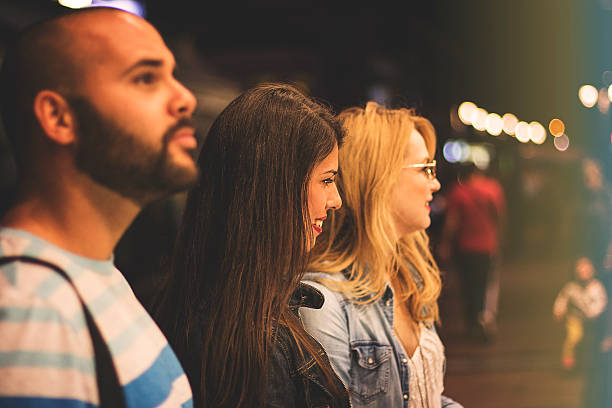 istock Three friends in the evening shopping 613326172