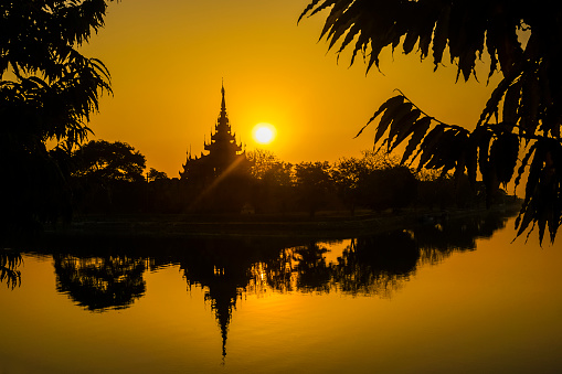Moat and Fort of Mandalay palace at sunset.