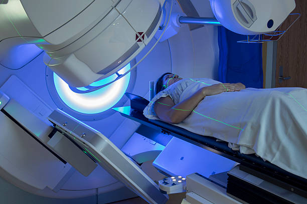 Woman Receiving Radiation Therapy Treatments for Breast Cancer stock photo