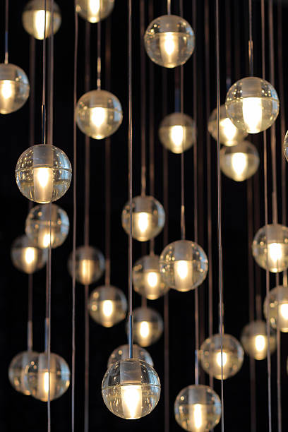 istock lighting balls on the chandelier in the lamplight, selective focus. 613329018