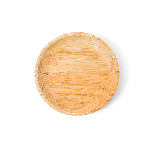 istock wooden plate over a white background 613329396