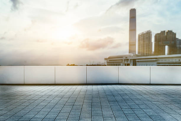istock empty pavement front of  Hong Kong victoria skyline 613330664