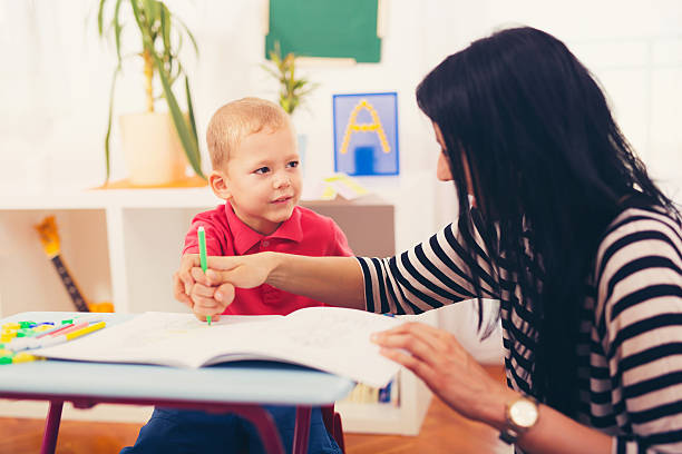 istock Child boy and mother playing with educational toy 613334054
