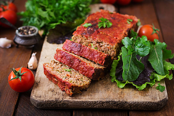 istock Homemade ground meatloaf with vegetables. 613334322