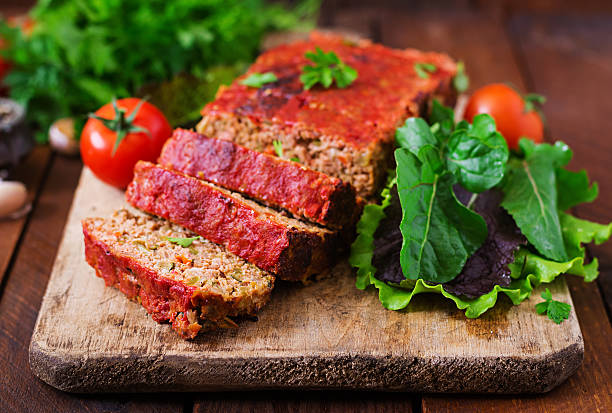 istock Homemade ground meatloaf with vegetables. 613334402