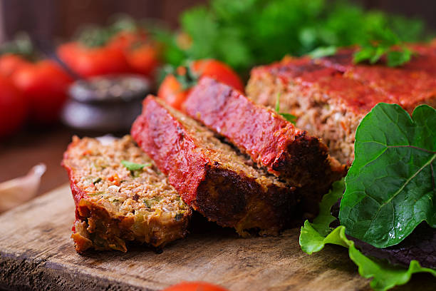 istock Homemade ground meatloaf with vegetables. 613334434