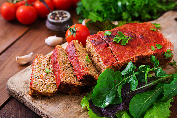 istock Homemade ground meatloaf with vegetables. 613334512