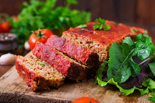 istock Homemade ground meatloaf with vegetables. 613334580