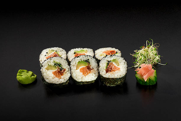 istock small set fresh sushi rolls decorated with seaweed salad 613335228