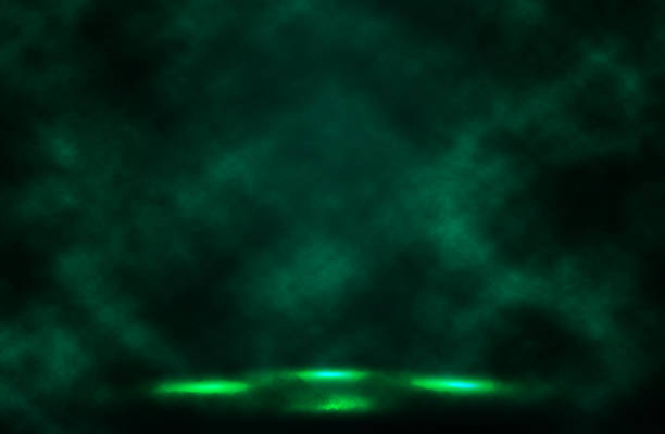 istock Dark green spotlight smoke background. 613335314