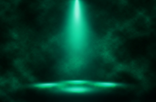 Green spotlight smoke stage background.