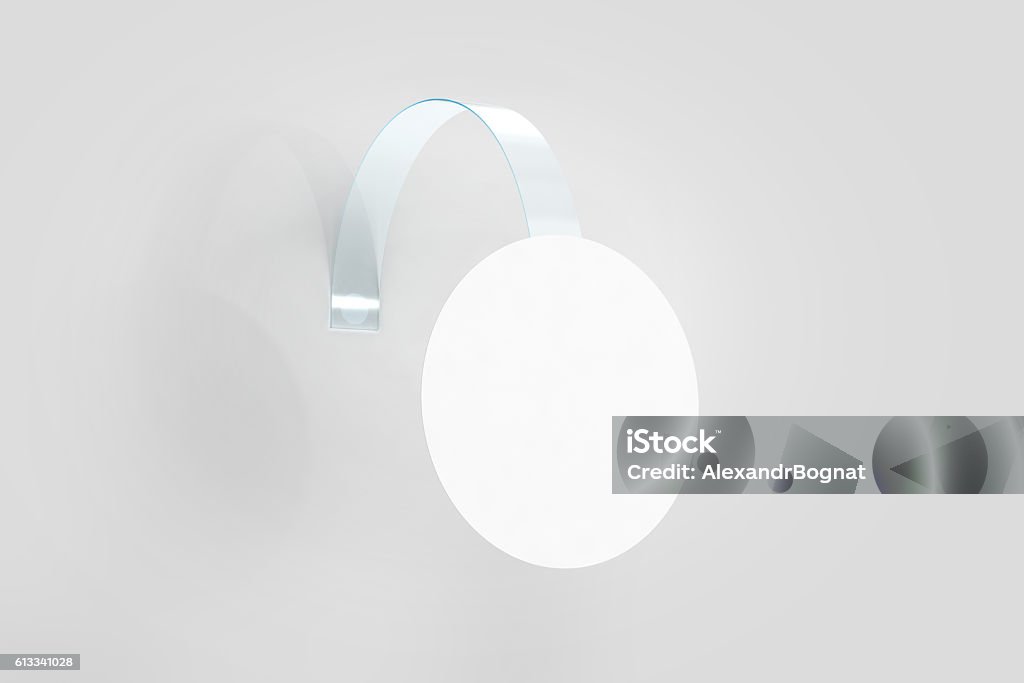 Blank white wobbler hanging on wall mockup, clipping path Blank white wobbler hanging on wall mockup, clipping path, 3d rendering. Space round paper mock up on plastic transparent strip. Clear price sticker circle shape. Pricing tag label template isolated. Shelf Wobbler Stock Photo