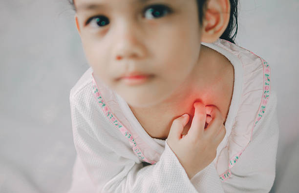 asia young girl scratch the itch with hand ,neck, itching