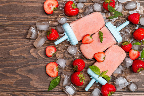 istock Homemade strawberry ice cream or popsicles 613341412