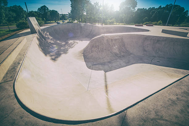 Skate Park in the daytime. Urban design concrete skatepark. skating skate park skatepark design skateboard skateboarding empty concrete - stock image extreme skateboarding stock pictures, royalty-free photos & images