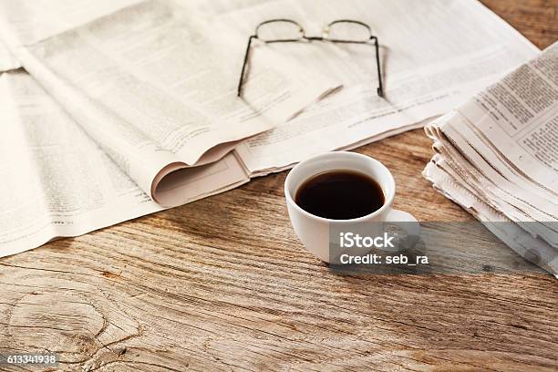 Newspaper With Coffee On Table Stock Photo - Download Image Now - Newspaper, Table, Backgrounds