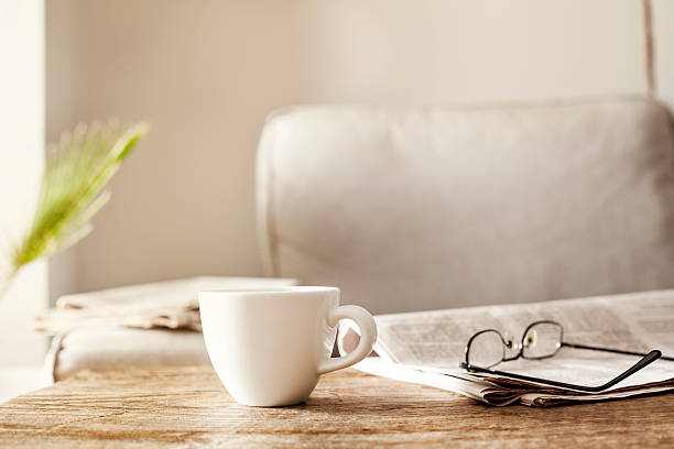 istock Newspapers with eyeglasses and coffee 613342348