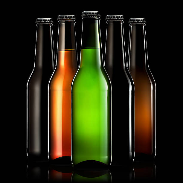istock Set of beer bottles isolated on black background 613344404