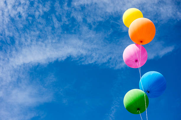 colorful balloons over sky - balloon blue bunch cheerful imagens e fotografias de stock