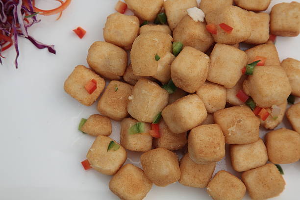 Close up shot of Indonesian local cuisine tahu gejrot ( fried tofu in chili soy sauce )