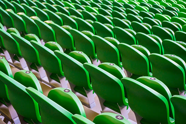 istock Seating rows in a stadium with weathered chairs 613347056