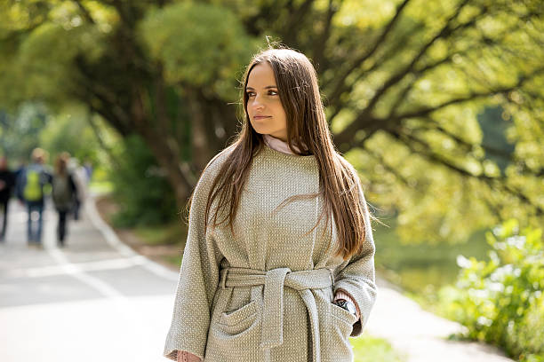 istock Attractive confident young woman in park 613347276