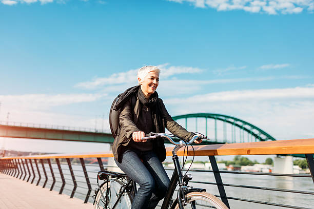 istock Mature Woman Riding Her Bicycle. 613348022