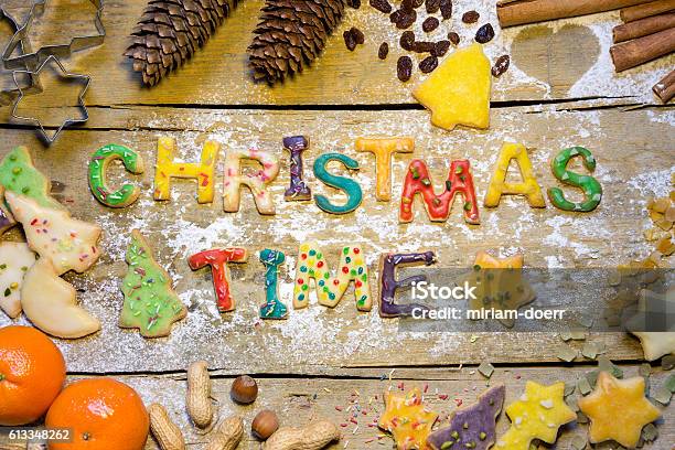 Biscuit Letters And Christmas Decoration On Wood Christmastime Stock Photo - Download Image Now